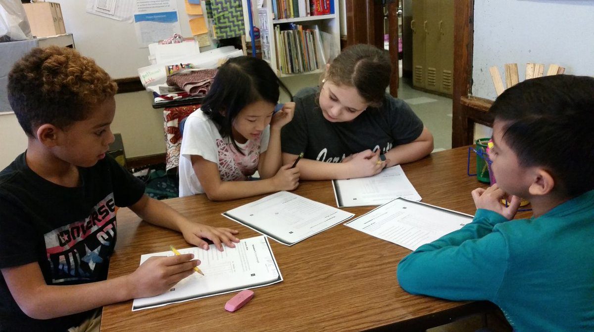 four students in small group